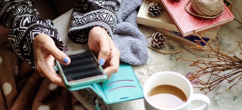 A girl holding a smart phone.