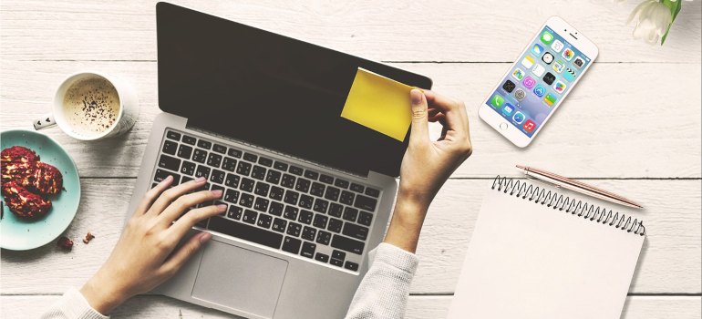 A woman working on a laptop.