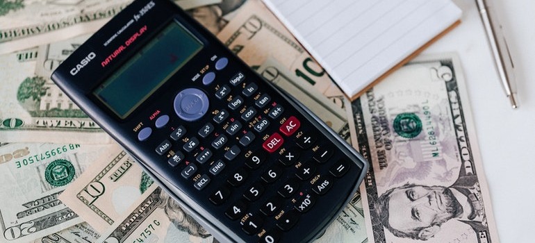 a calculator, and some dollar bills
