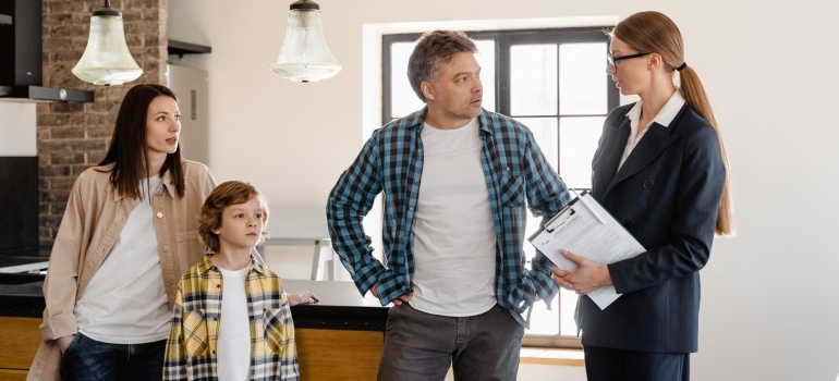 A family inspecting a new home before moving in