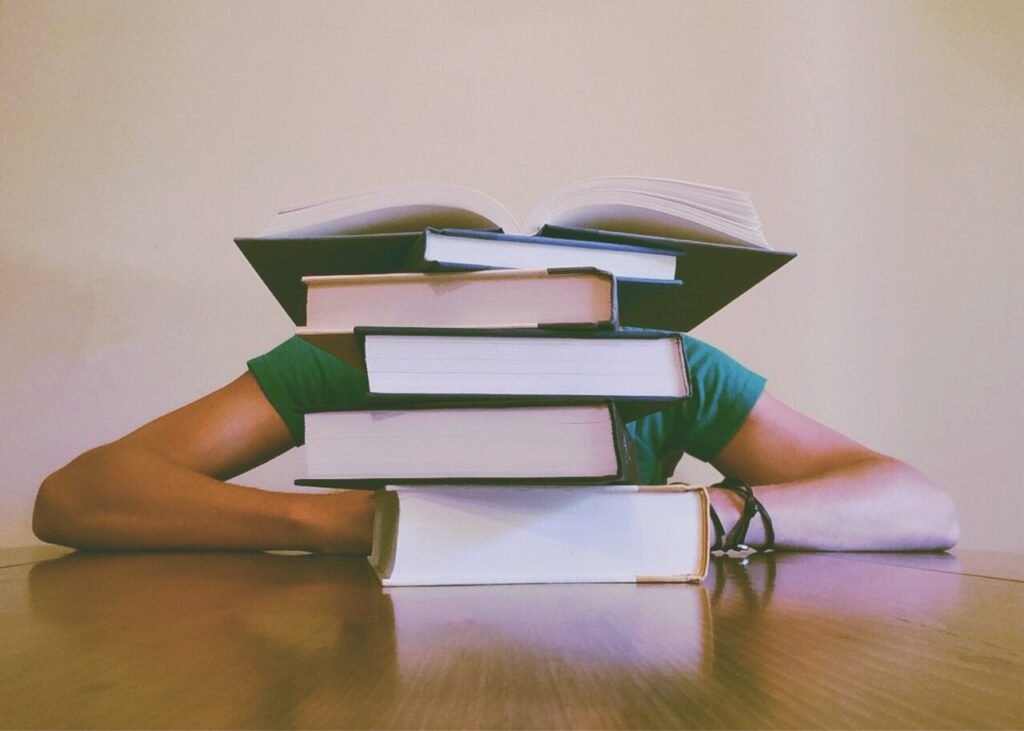 a woman in front of books