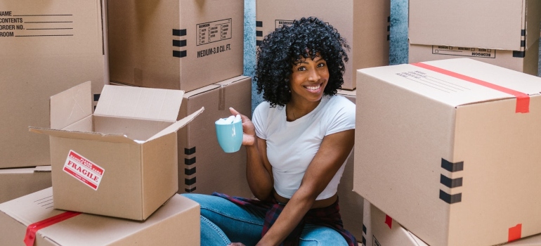 A person who enjoys drinking coffee during a move.
