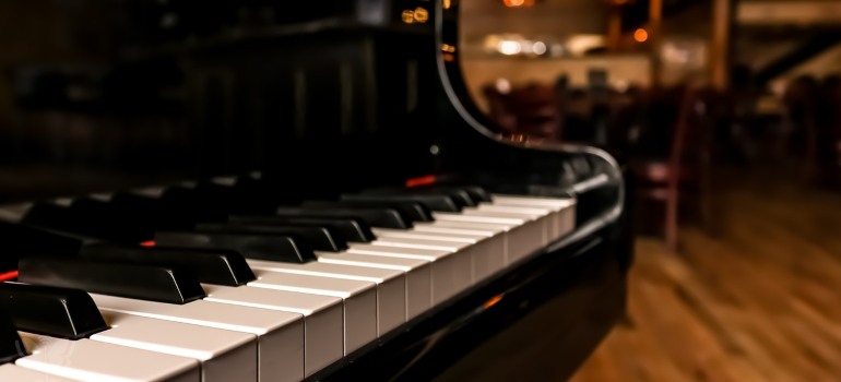 A close-up of a piano to be relocated by the top movers in Philadelphia.