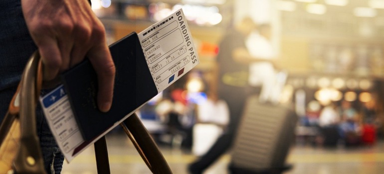 A man holding a boarding pass.