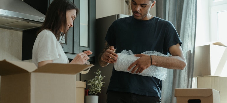 A couple packing for the move