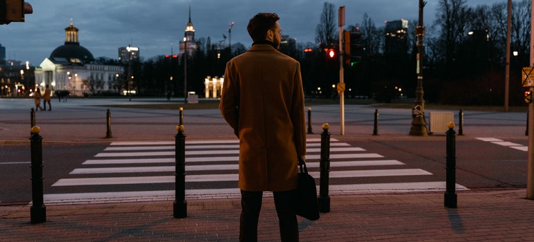 man standing in front of a crosswalk.