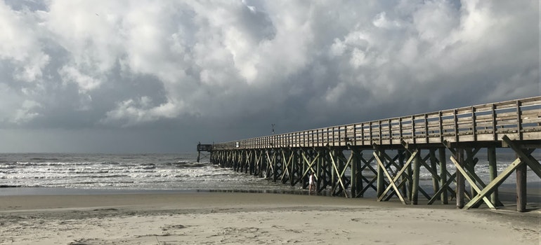 a beach at the cloudy weather you can enjoy after relocation to Charleston with the help of long distance moving companies