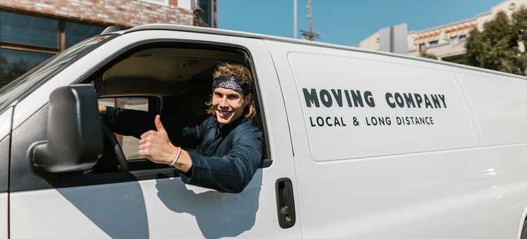 a man in a moving company van