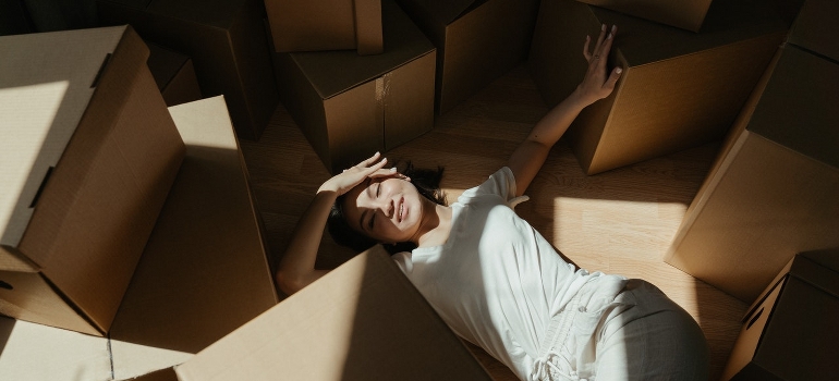 woman in a pile of boxes