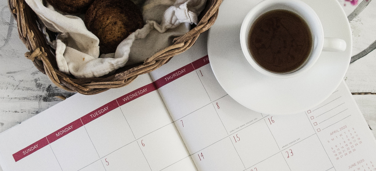 A cup of coffee on a paper calendar.