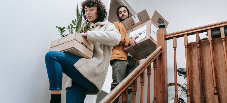 A man and a woman moving out from their home