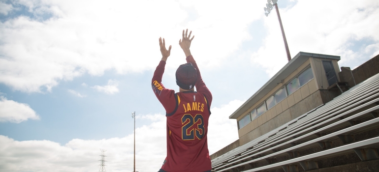a man plays basketball in Cavaliers jersey