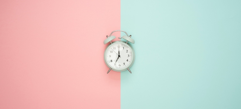 blue clock on the pink and blue background