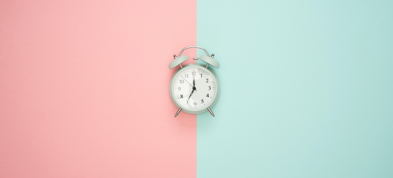 clock on the blue and pink background