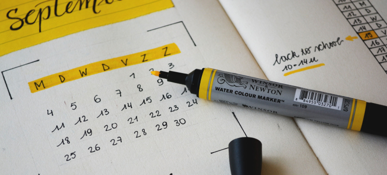 A magic marker placed on the top of the calendar.