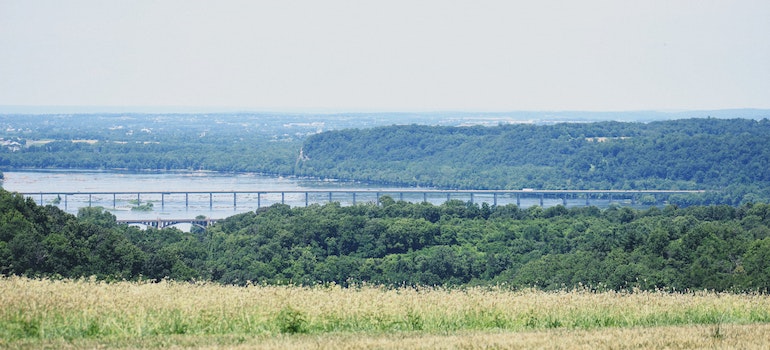 A bridge in Pennsylvania photographed from the field in the distance.