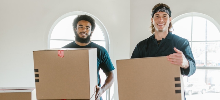 men with boxes working for cross country moving companies Woodbridge.