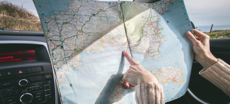 A woman pointing to a map