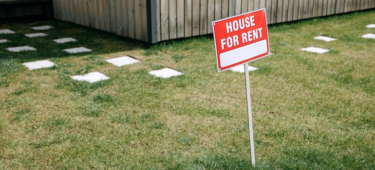 A for rent sign in front of the house
