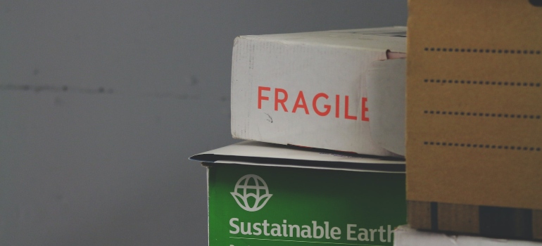Boxes with 'fragile' written on them, that someone is preparing before moving from Virginia to California