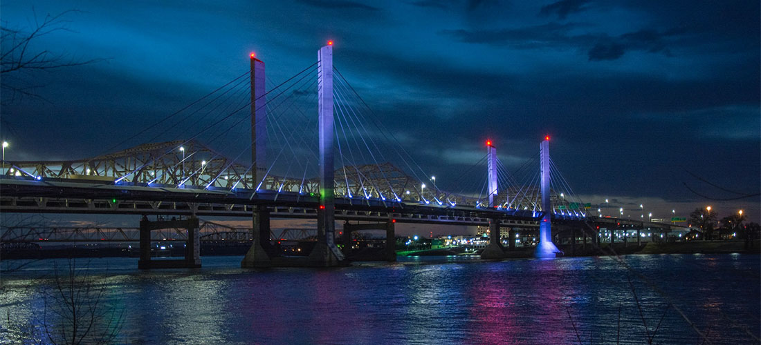 A bridge in Louisville during night.
