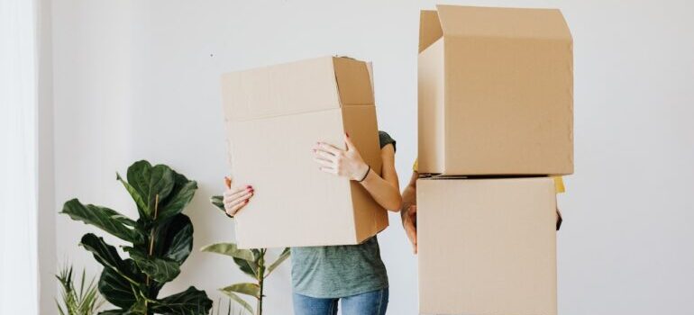 People holding boxes for moving