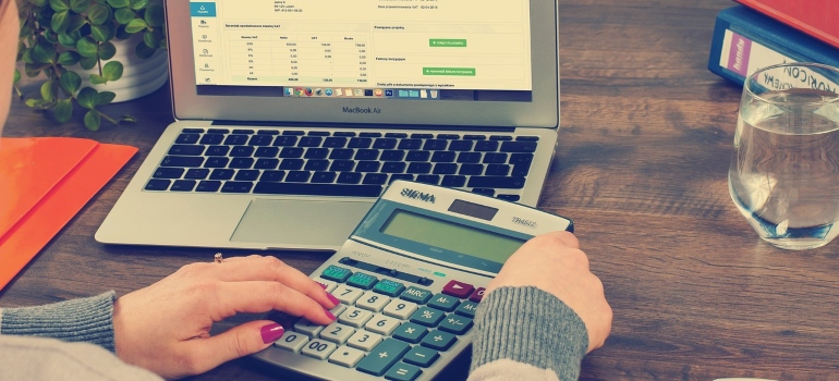 a woman trying to create a moving budget on her computer