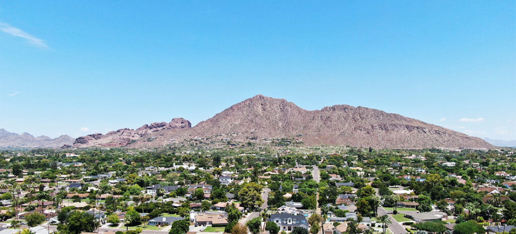 The city of Phoenix with a hill in the background.