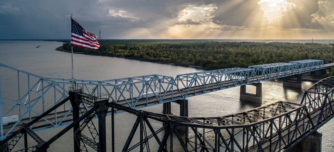 A bridge in Mississippi with the USA flag on it.