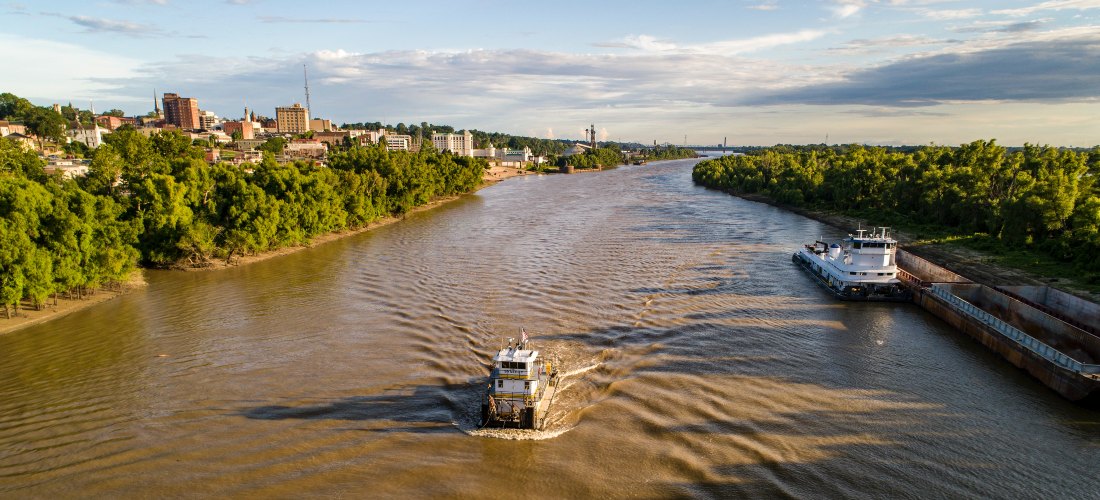 A boat cruising on the Mississippi River