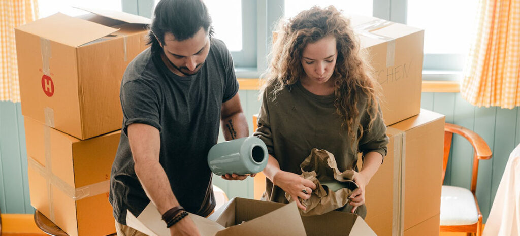 A man and a woman packing up their home.