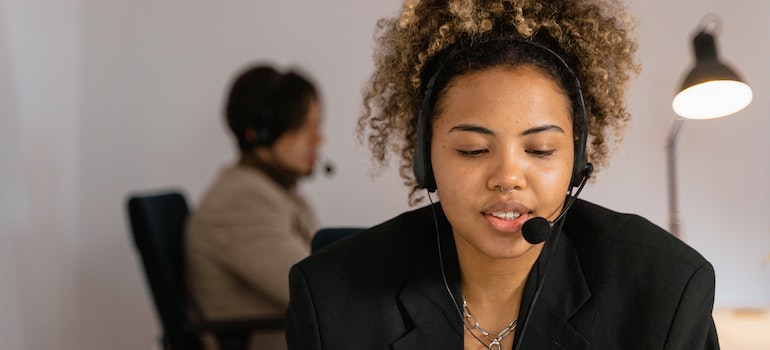 A woman in customer support dealing with customer complaints, which is one of the biggest challenges for moving companies