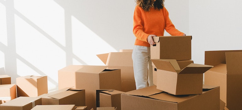A woman packing on time to simplify her move