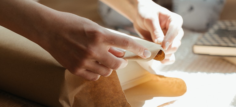 A person packing an item