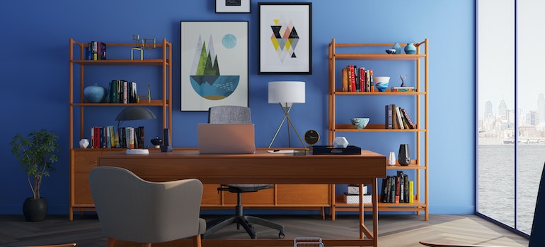 A home office with a blue wall