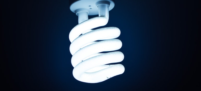 A LED light bulb, one of the items that should be used when going green in your storage unit