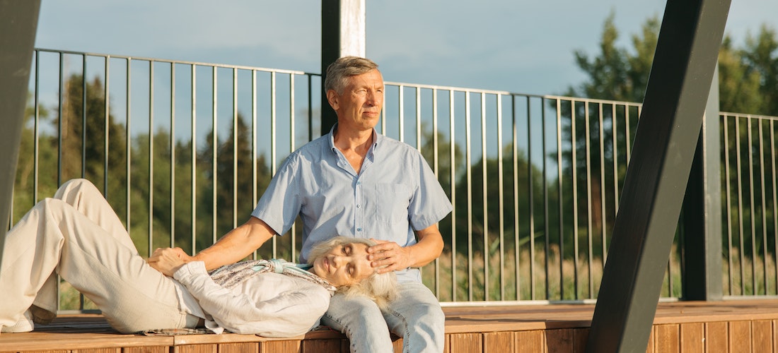 Two retirees sitting on a bench