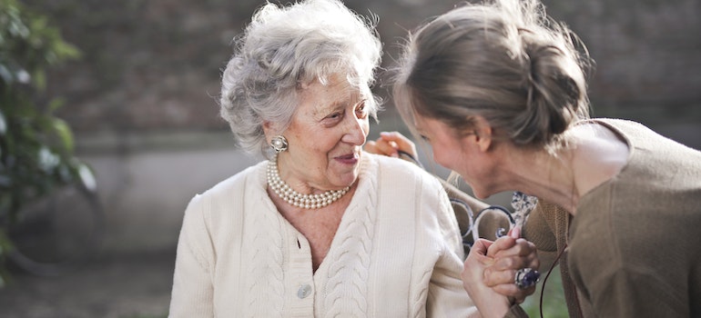 A granddaughter and a grandma talking about senior moving