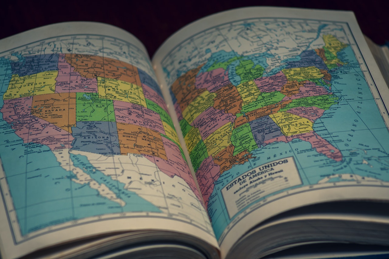 Open pages in an atlas with the United States map