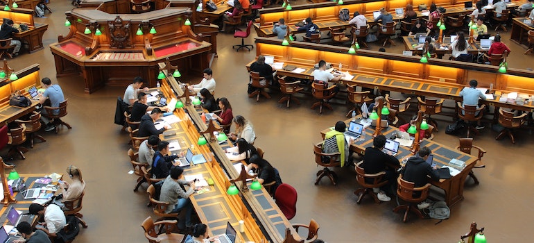 Students in studying in a big library on one of the best states for international students