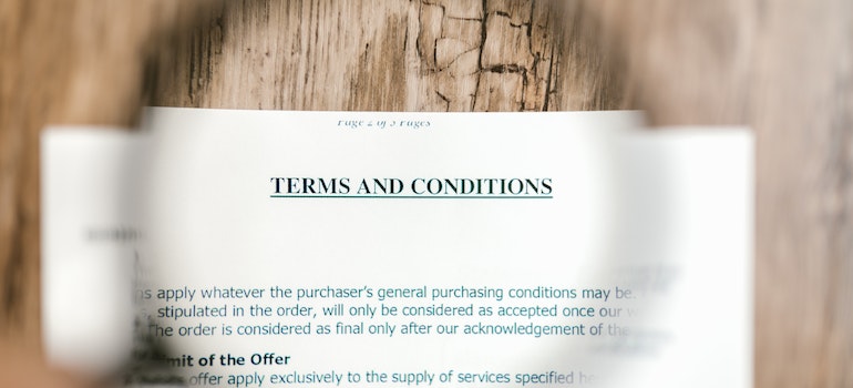 Focus on "Terms and conditions" words written on a contract