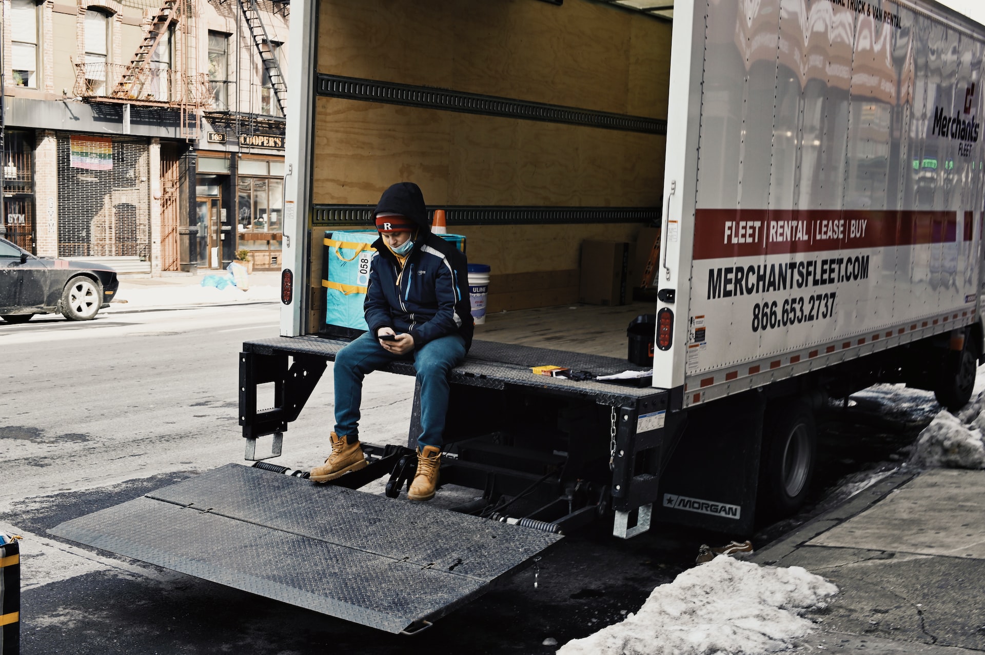 Man sitting in the back of a truck