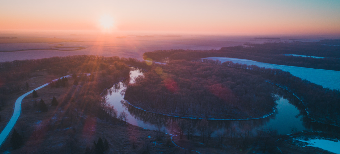 Aerial view of a river in North Dakota underneath the sunset