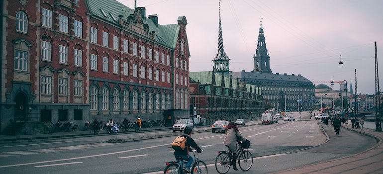 People driving bikes after moving to Denmark from US