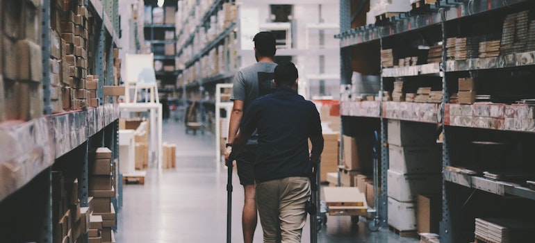 Men Going Around a Warehouse