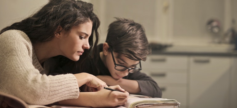 Two people writing