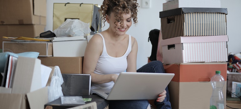 A woman looking at a laptop