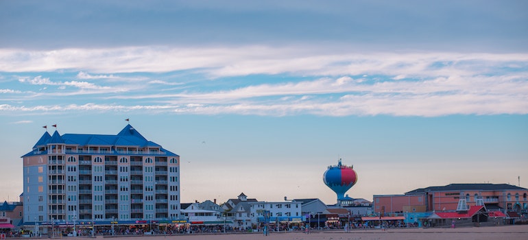 View of the busy Boardwalk at sunset in Ocean City, Maryland