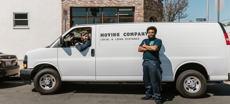 Movers in the street waiting to help someone relocate