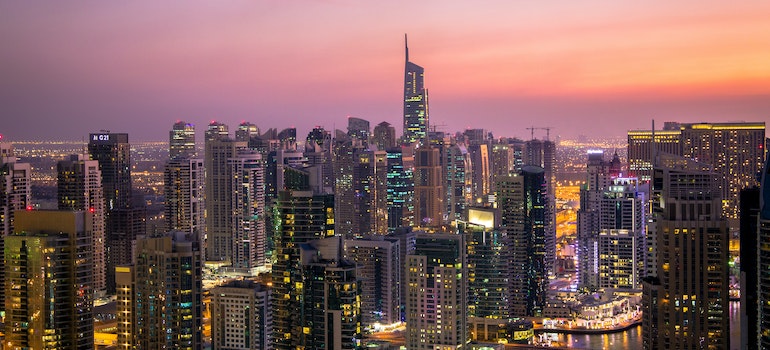 A photo of Dubai buildings during the night